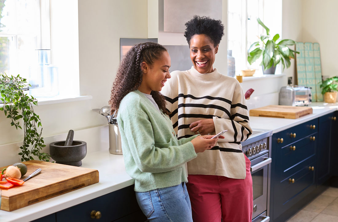 mom and daughter standing in the kitchen