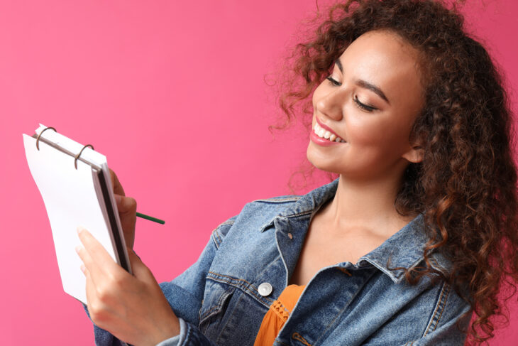 woman writing something down